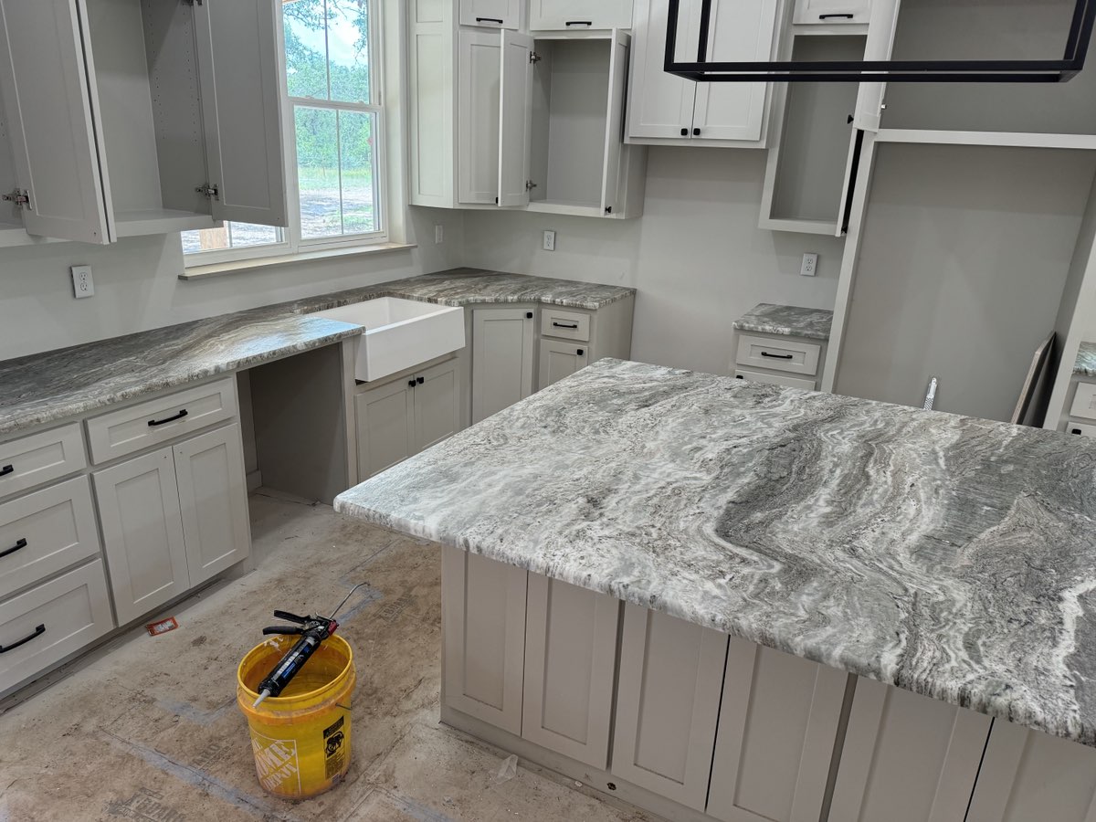 Brown Fantasy marble full kitchen island and perimeter countertops — Central Texas installation